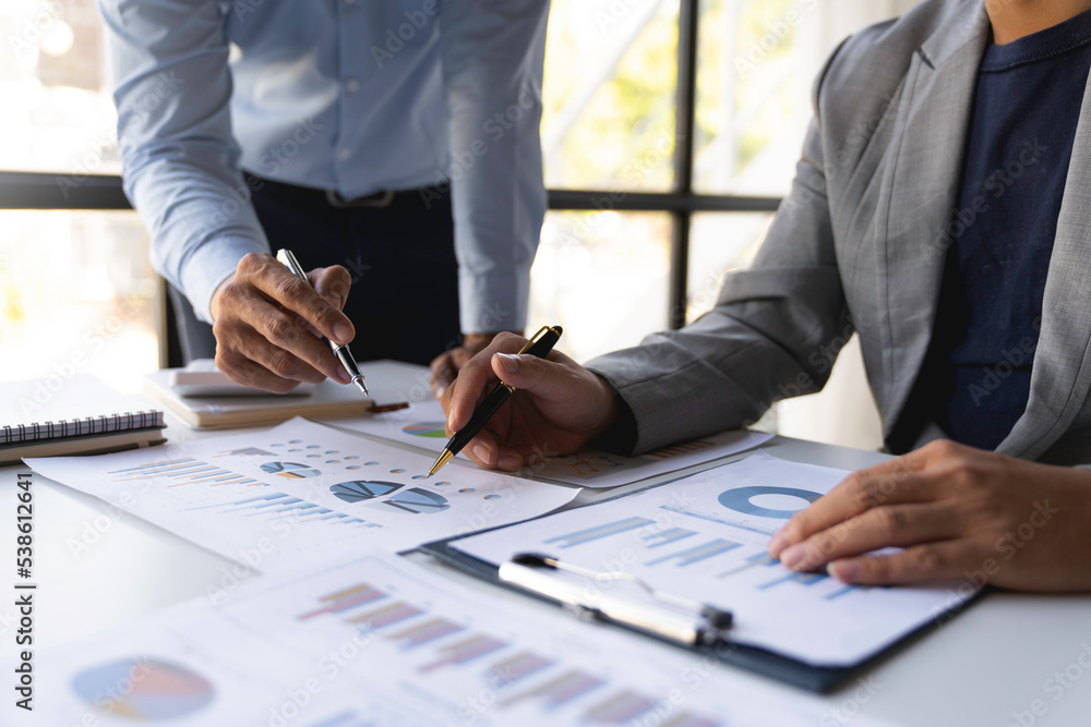 Business People Talking Discussing with concept coworker planning analyzing financial document data charts and graphs in Meetings and successful teamwork. Business People Talking Discussing with concept coworker planning analyzing financial document data charts and graphs in Meetings and successful teamwork.