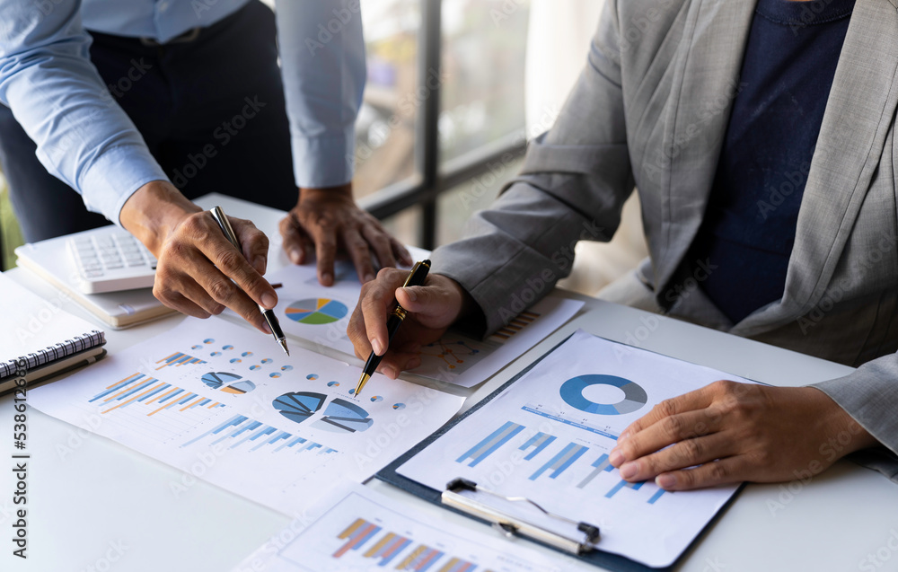 Business People Talking Discussing with concept coworker planning analyzing financial document data charts and graphs in Meetings and successful teamwork. Business People Talking Discussing with concept coworker planning analyzing financial document data charts and graphs in Meetings and successful teamwork.