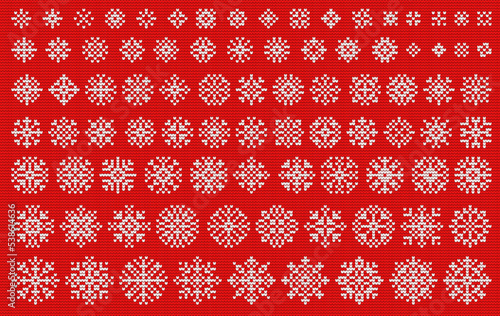 Knitted snowflakes set. White embroidered snowflakes of different sizes on a red background. Design elements for Christmas cards, invitations, fabric prints.