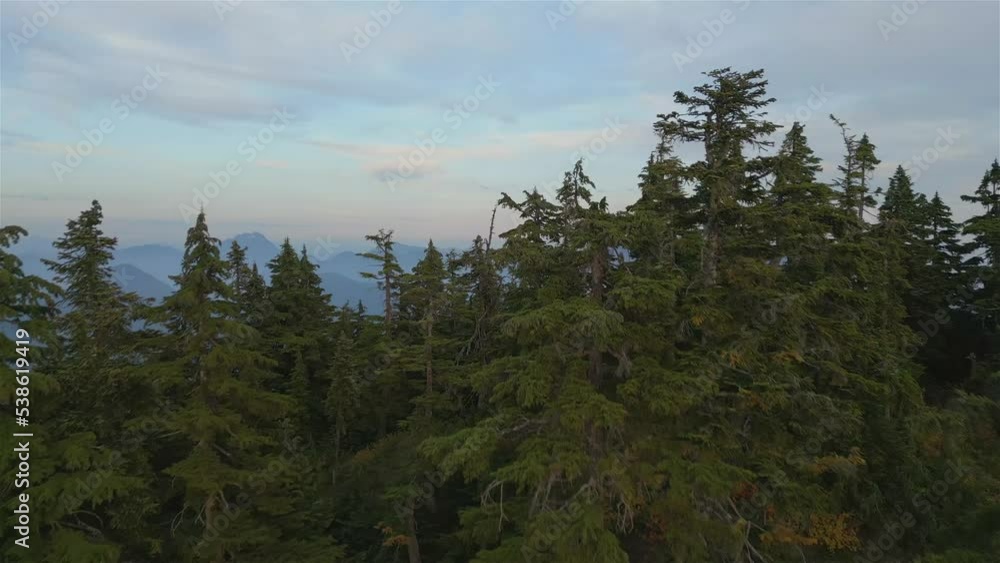 Canadian Mountain Landscape on the West Coast of Pacific Ocean. Dramatic Sunset and Hazy Smoky Sky. St. Mark's Summit near Vancouver, British Columbia, Canada. Nature Background Cinematic