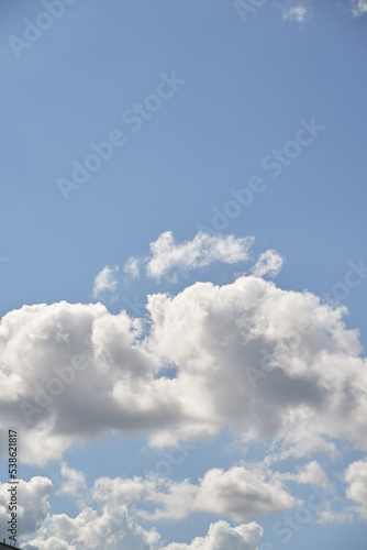 White clouds in the summer sky. Cloudscape background. Concept of climate change.