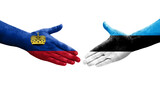 Handshake between Estonia and Liechtenstein flags painted on hands, isolated transparent image.