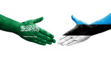 Handshake between Estonia and Saudi Arabia flags painted on hands, isolated transparent image.