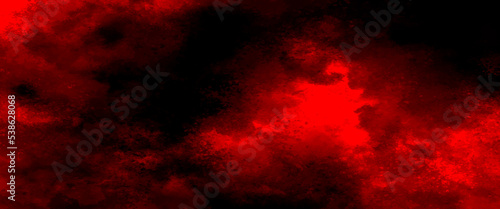 Red powder explosion on black background. Freeze motion of Red dust particles splash, grunge background texture for banner, backdrop.