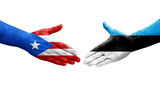 Handshake between Estonia and Puerto Rico flags painted on hands, isolated transparent image.