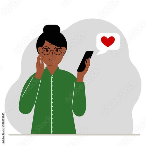 Satisfied woman reads a message on his mobile phone. Message with red heart. Vector