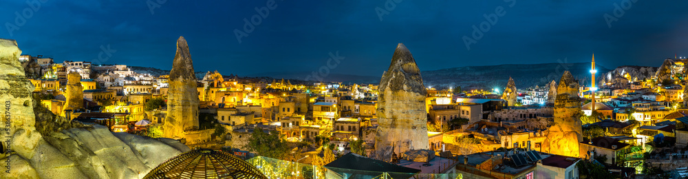 Panoramic view of Goreme, Turkey. Goreme is known for its fairy chimneys, eroded rock formations, many of which were hollowed out in the Middle Ages to create houses, churches and underground cities.