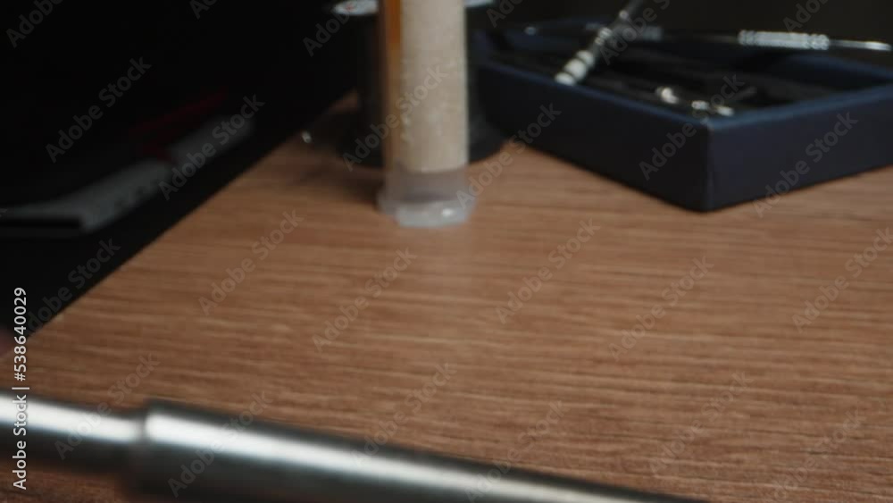 I apply solder to the soldering iron and solder the charging connector. close-up. I apply solder to the soldering iron and solder the charging connector. close-up.