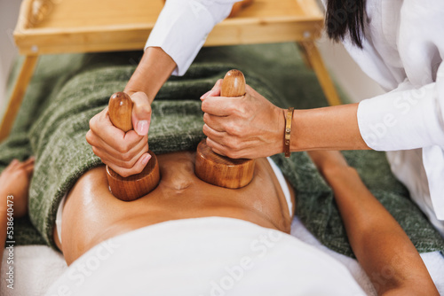 Maderotherapy Massage With Wooden Cup In A Spa Centre photo