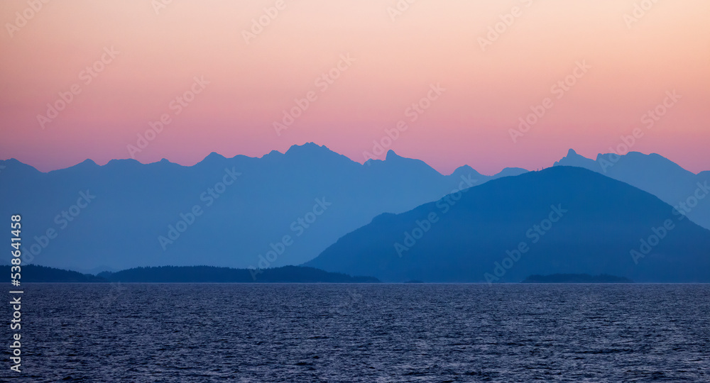 Colorful Sunrise on West Coast of Pacific Ocean with Islands and Canadian Mountain Landscape. Howe Sound near Vancouver, British Columbia, Canada. Nature Background