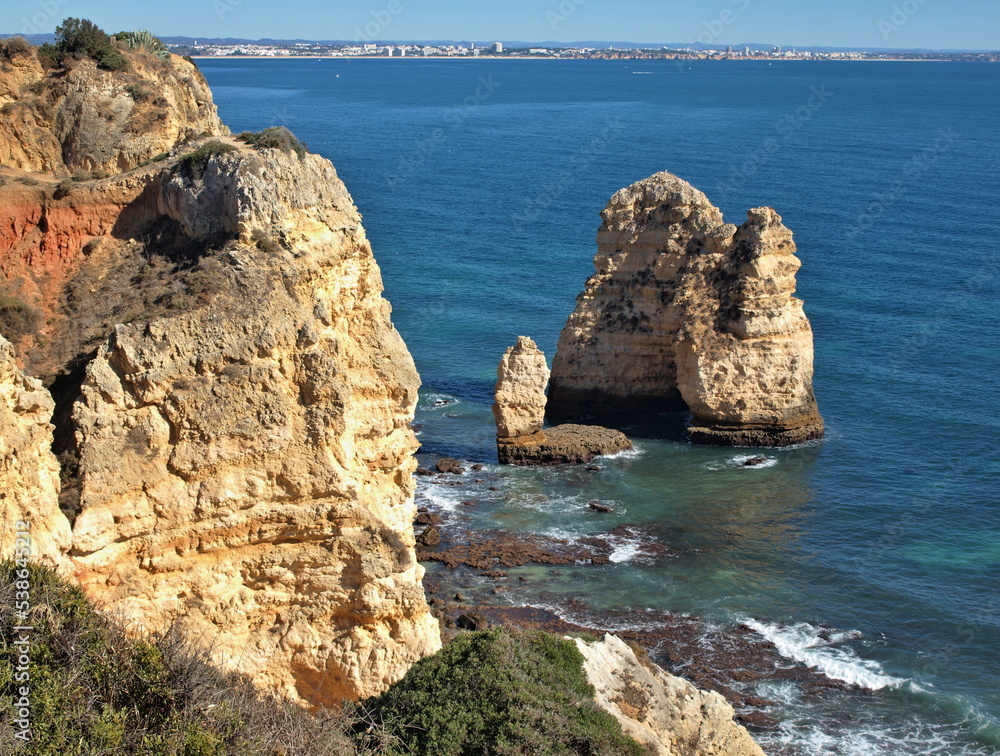 Naklejka premium Typical rocky coastline near Lagos, Algarve - Portugal