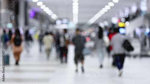 blur of people walking in airport terminal