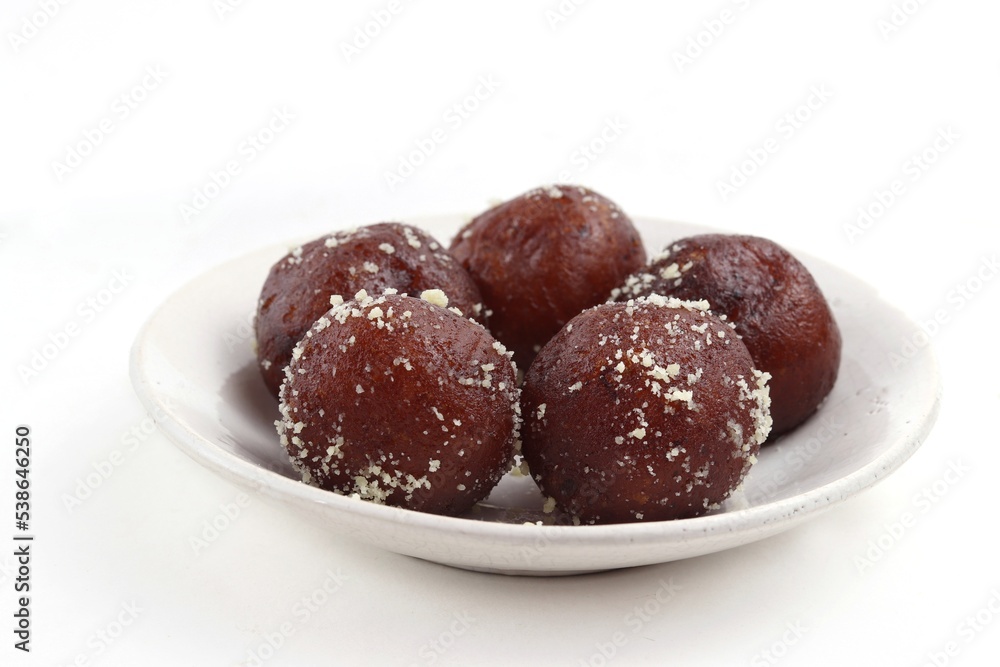Closeup of Kala Jamun Indian Sweets in a Plate Isolated on White Background Closeup of Kala Jamun Indian Sweets in a Plate Isolated on White Background