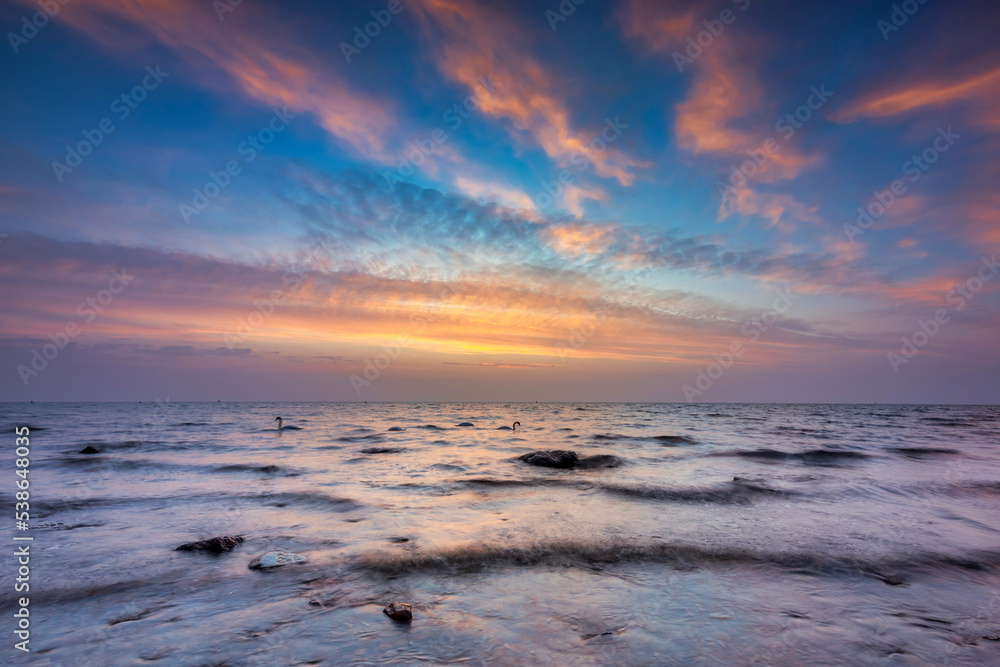 Beautiful sunrise by the Baltic Sea in Gdynia Orlowo, Poland Beautiful sunrise by the Baltic Sea in Gdynia Orlowo, Poland