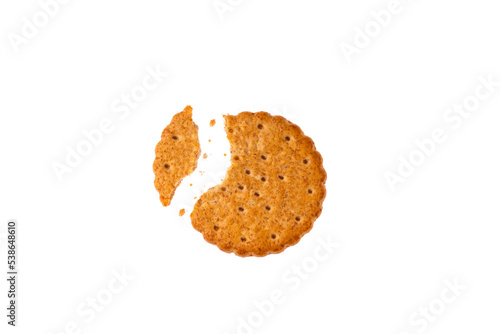 Fotografie wholemeal biscuit with a bite and crumbs isolated on white background text space