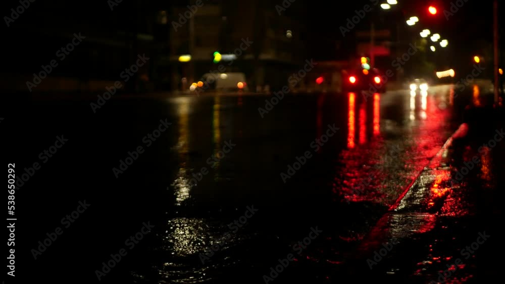 Night street of a big city with slight illumination after a downpour. Night street of a big city with slight illumination after a downpour.
