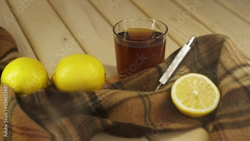 Tea with lemon thermometr photo