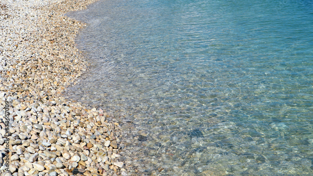 Transparent blue sea, pebble beach, beautiful sea background, seascape, seaside vacation, sea wallpaper