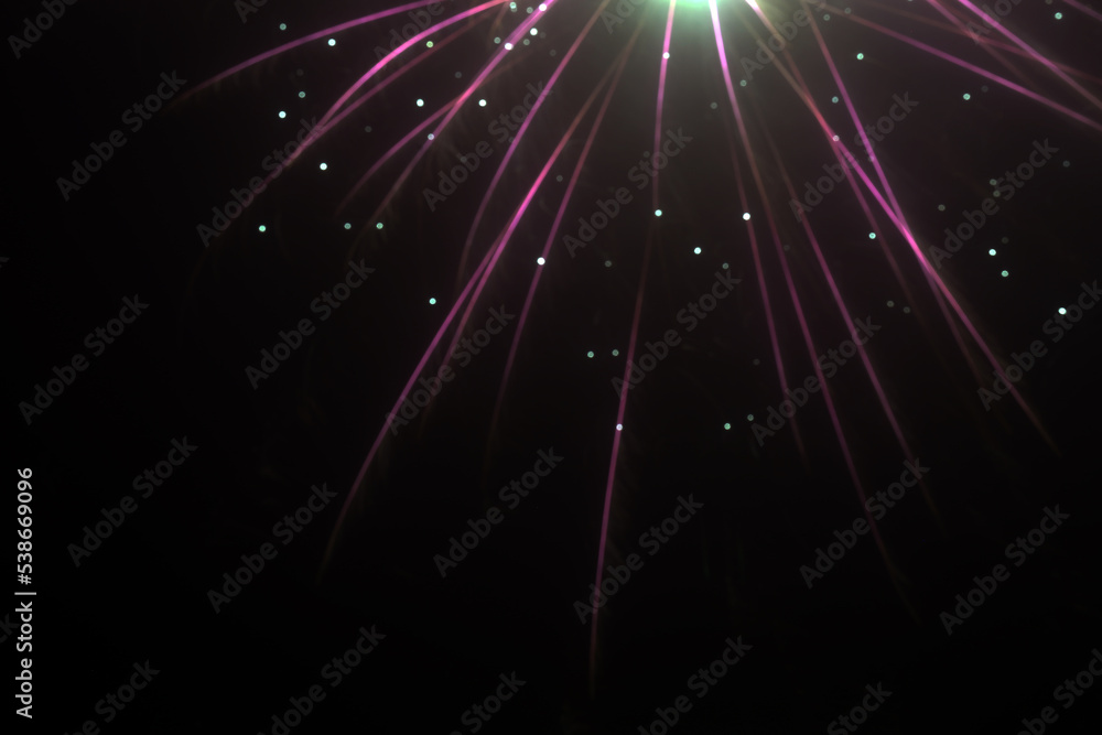 Celebrating holidays and big events with colorful fireworks exploding at the sky. 4th of July, New Year's Eve and other parties go to next level with a burst of firework! Black background color image.