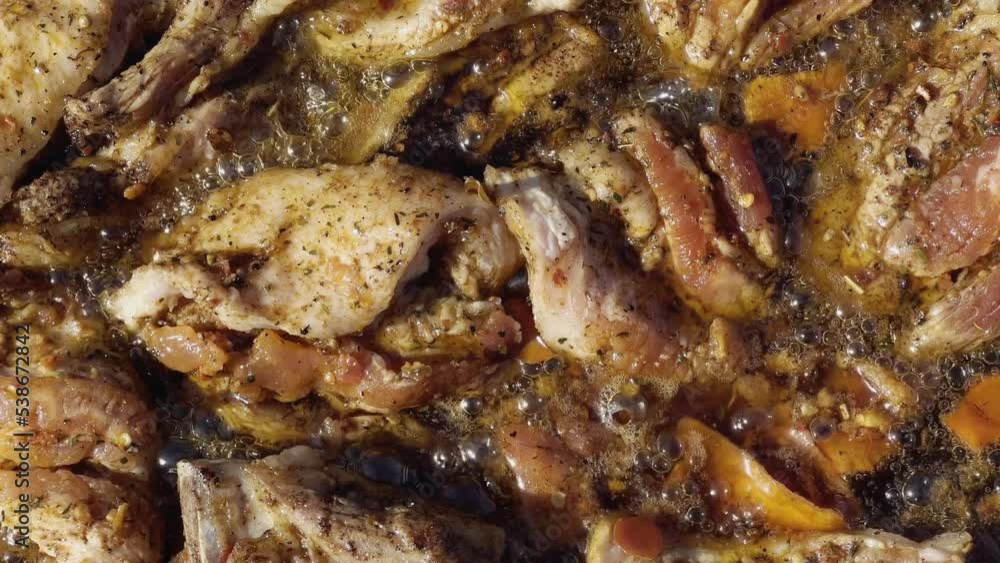 Close-up meat pieces are fried in oil on an open fire of a wood-burning stove. Slow motion video. High quality 4k footage Close-up meat pieces are fried in oil on an open fire of a wood-burning stove. Slow motion video. High quality 4k footage