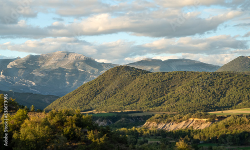 Fototapeta Naklejka Na Ścianę i Meble -  magnificent view over the Parque natural de la Sierra y los Cañones de Guara to the Spanish Pyrenees mountains