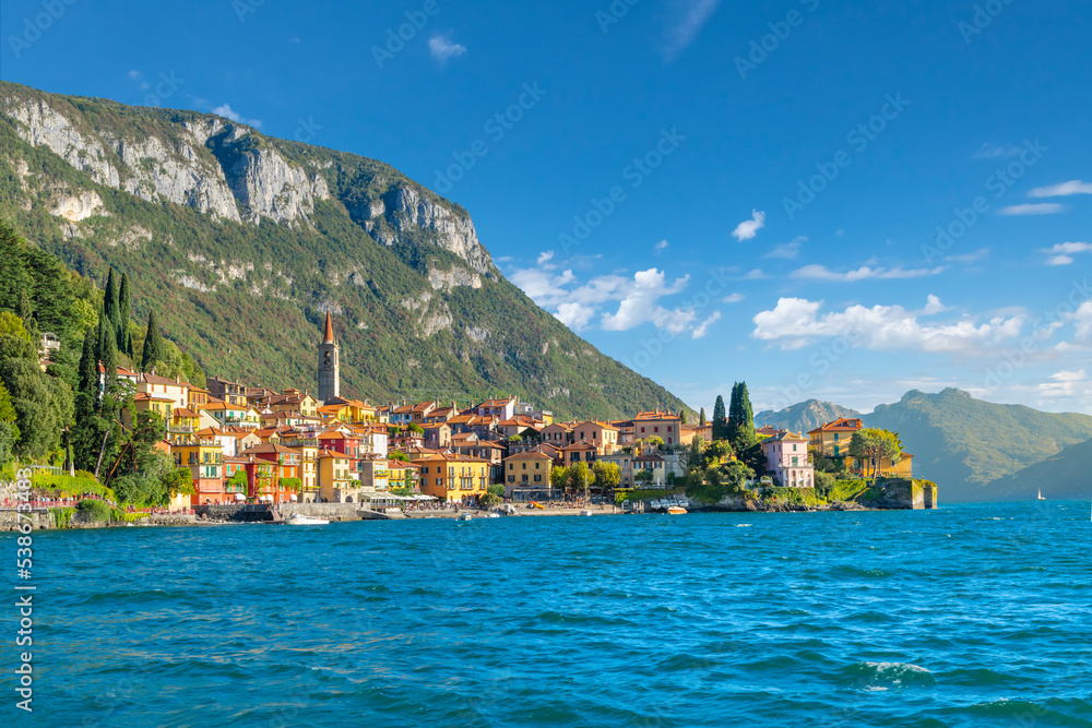 The colorful lakeside resort village of Varenna, Italy, with brightly painted medieval homes and shops along the coast of Lake Como in Northern Italy.
