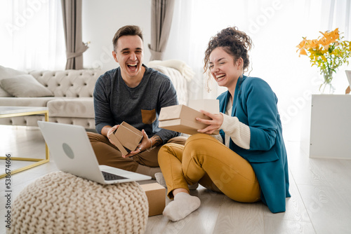 couple woman and man open presents gift during video call online