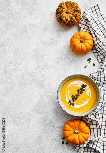 Homemade autumn pumpkin soup with squash seeds
