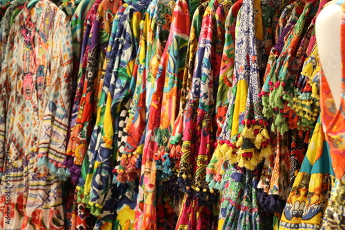 colorful summer women's clothes on display colorful summer women's clothes on display © fiore26