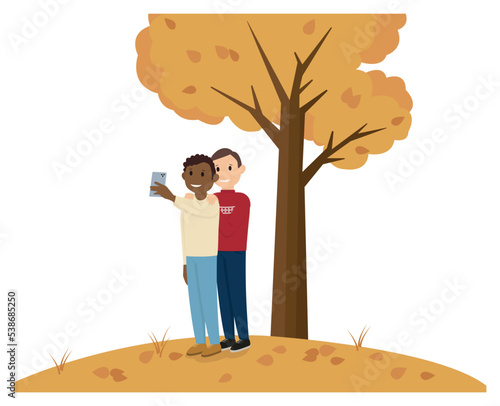 LGBT couple taking selfie autumn
