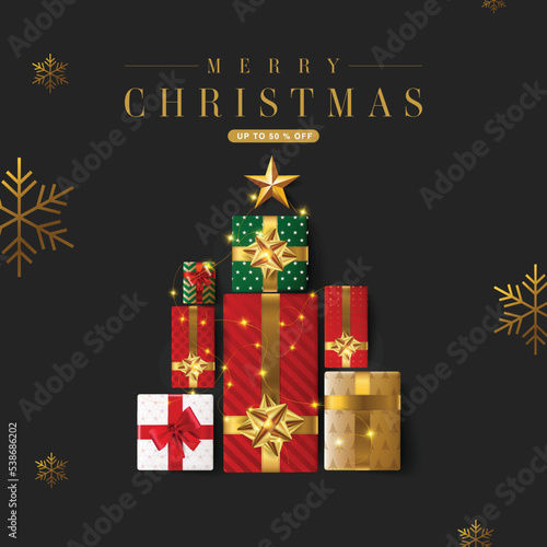 Christmas gift boxes laid out in the shape of a Christmas tree, overhead view. Merry Christmas