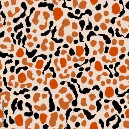 Animal mix seamless pattern. Hand drawn cheetah, leopard stains. Beige, orange, red and black colored camouflage background