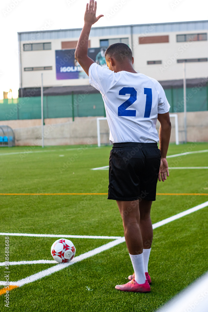 latin soccer player giving strategy instructions when taking a corner in a soccer game