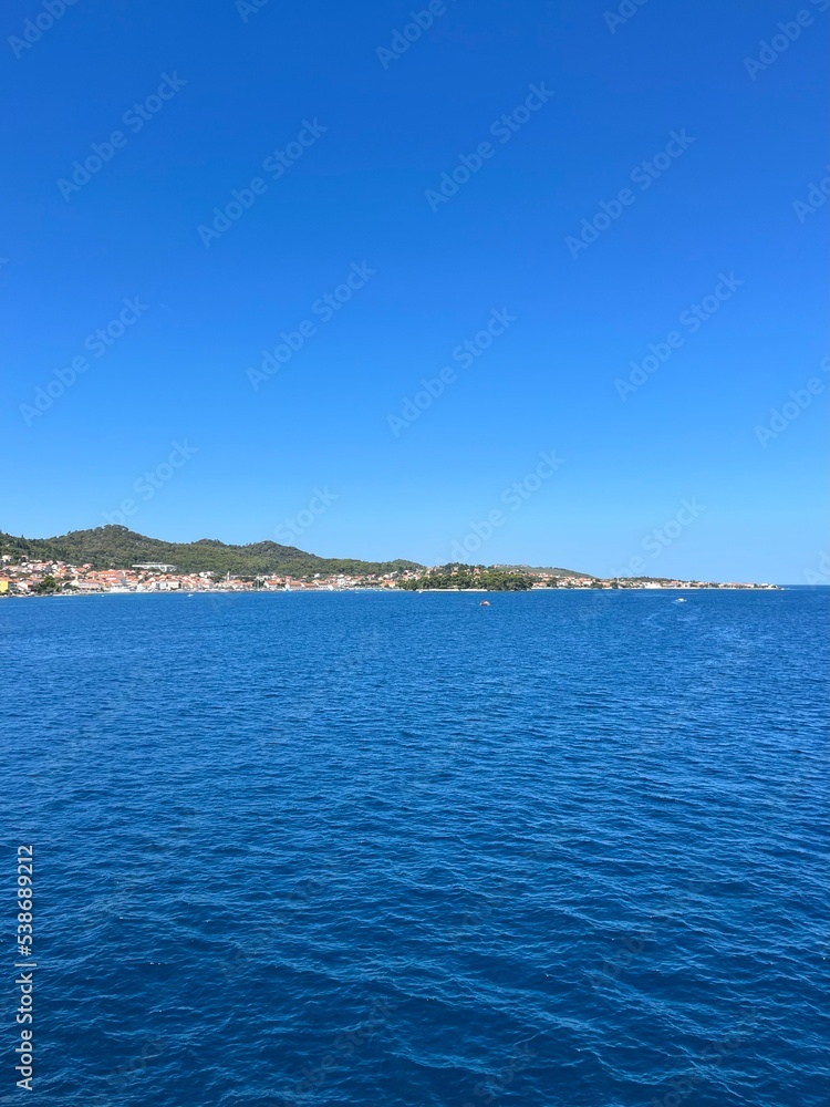Blue sea horizon, blue sky, natural colors, pure sea water surface