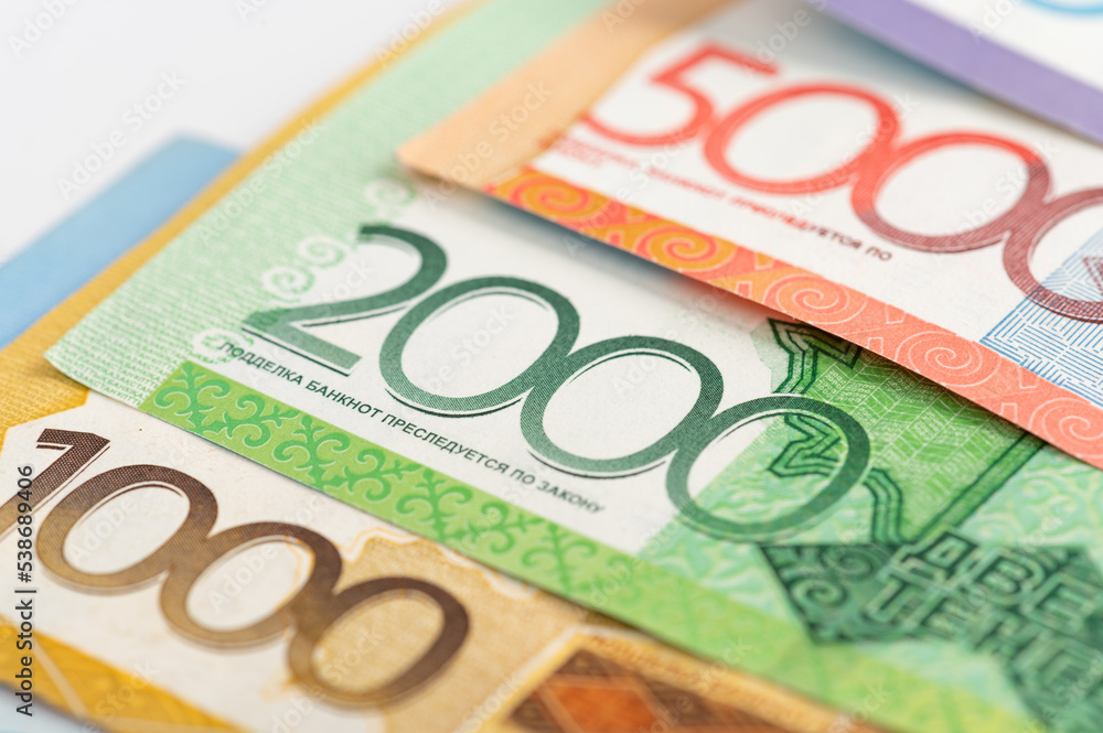 Kazakhstan money - tenge. 500, 1000, 2000, 5000, 10000 banknotes. Close up of tenge on white background. Kazakhstan money - tenge. 500, 1000, 2000, 5000, 10000 banknotes. Close up of tenge on white background.
