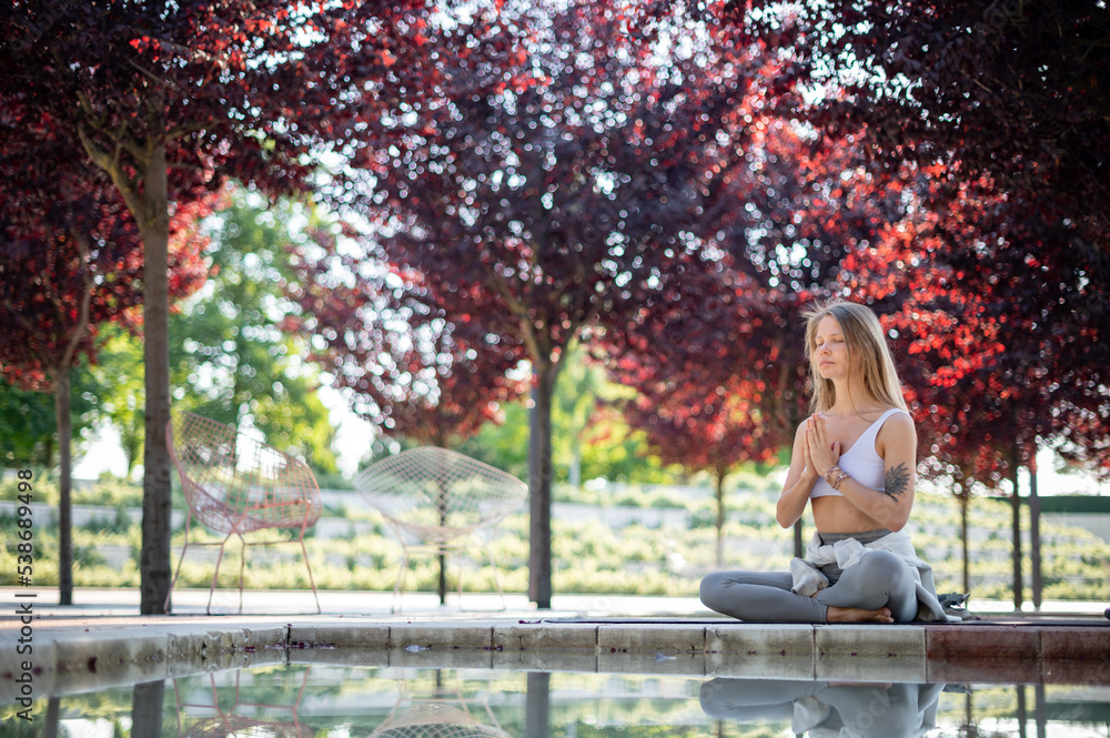 Girl practice yoga meditation outdoor in park Girl practice yoga meditation outdoor in park