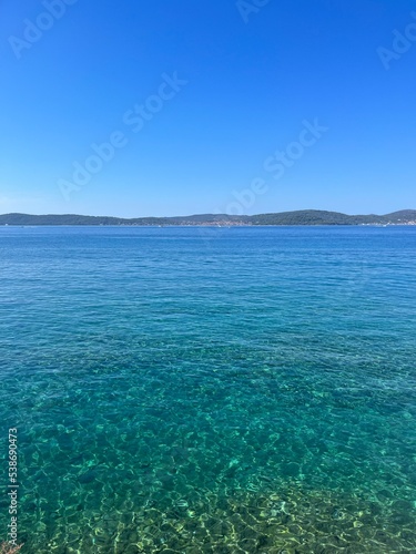 Blue sea horizon, blue sky, natural colors, pure sea water surface © Oksana