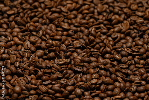 Texture of roasted coffee beans close-up  brown beans.