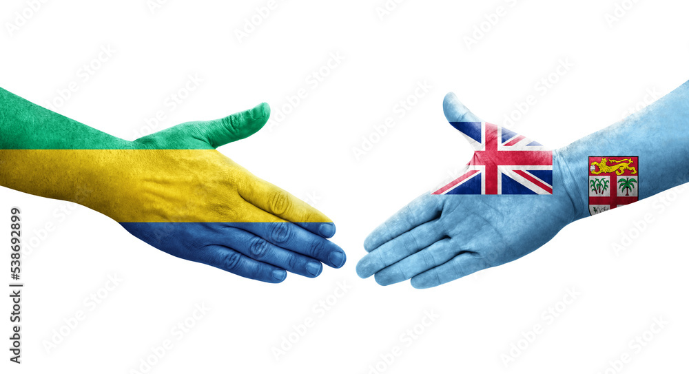 Handshake between Fiji and Gabon flags painted on hands, isolated transparent image. Handshake between Fiji and Gabon flags painted on hands, isolated transparent image.
