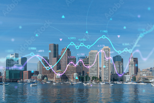 Panorama city view of Boston Harbor at day time, Massachusetts. Building exteriors of financial downtown. Glowing FOREX graph hologram. The concept of international trading and fundamental analysis