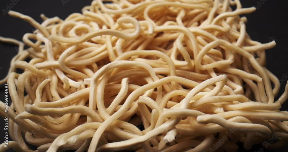 Raw Asian Ramen Noodle. Close up of Instant raw noodles. Dried instant noodles.
Raw Asian Ramen Noodle. Close up of Instant raw noodles. Dried instant noodles.