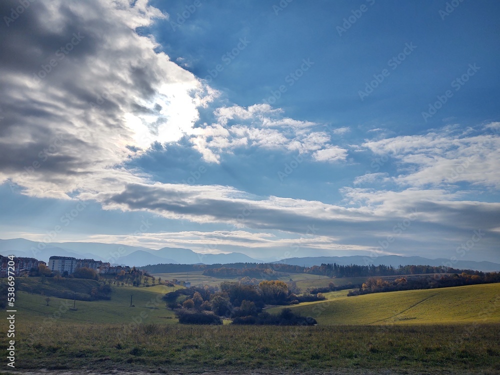 View to the city over the meadow, hills and buildings in the town. Slovakia View to the city over the meadow, hills and buildings in the town. Slovakia