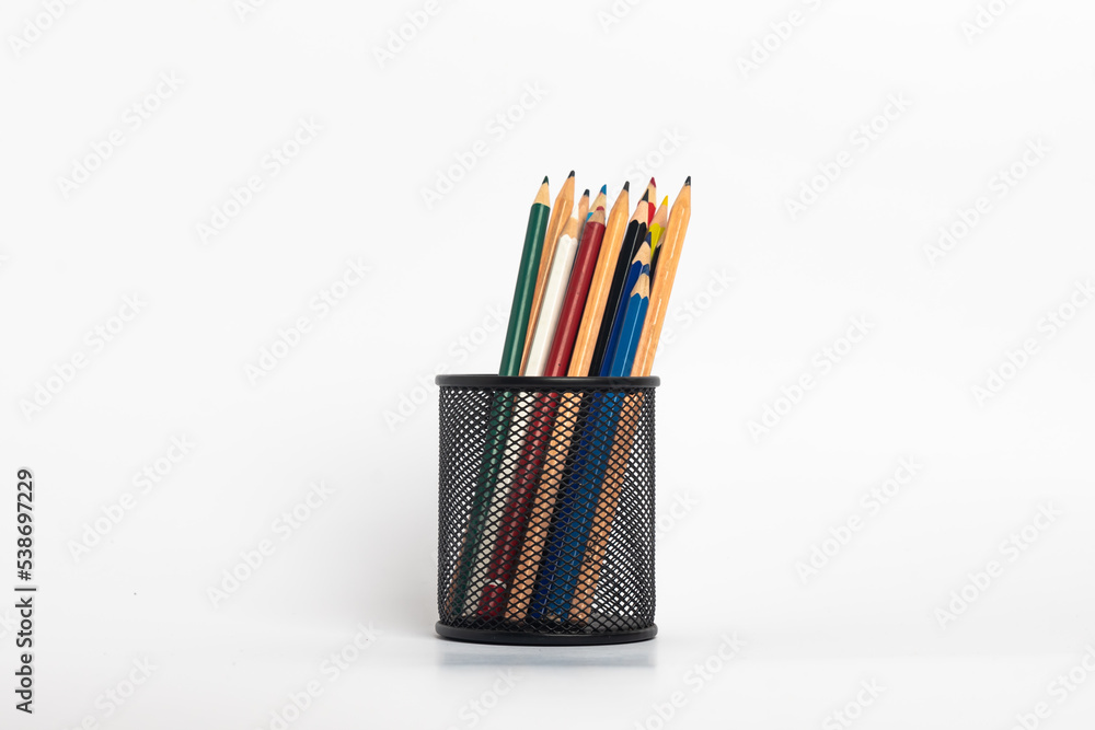 Fototapeta premium black pen holder full of colored pencils isolated on white background , Education consept idea