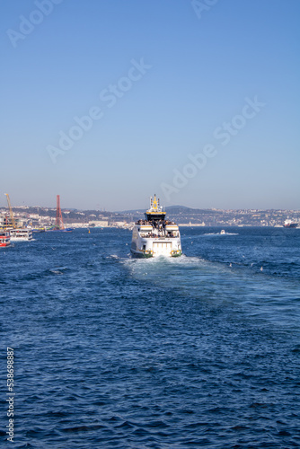 Istanbul, Turkey - February 2022: An excursion boat sailing in the Bosphorus of Istanbul, Turkey.
