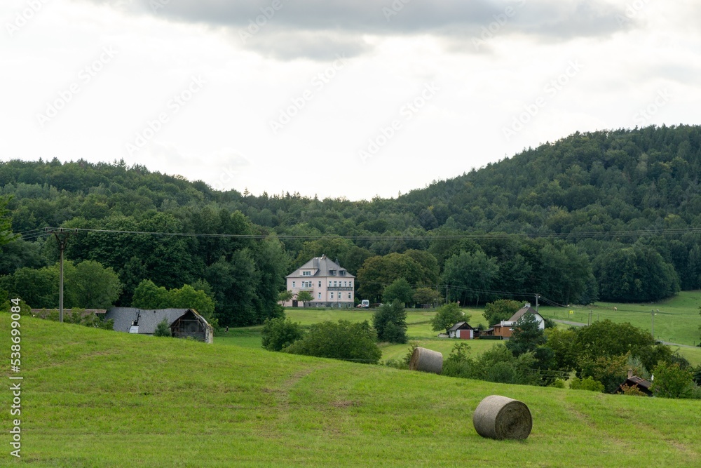 Obraz premium Hay bales and haystacks on the field during autumn. Slovakia
