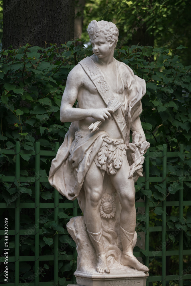 Obraz premium Marble statue of allegory of noon in Summer Garden, Saint Petersburg, Russia