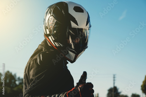 Portrait of a motorcycle rider with helmet. photo