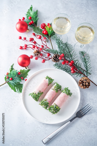 Ham cheese garlic rolls decorated with dill and cream sauce
