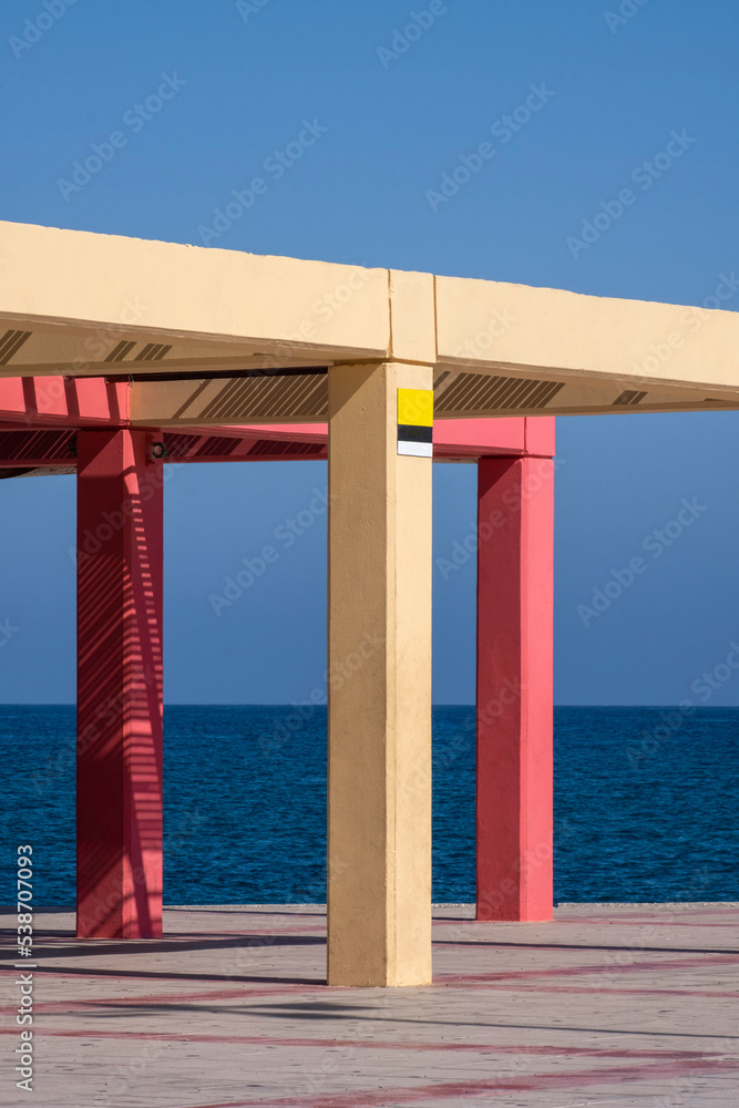 Colorful beach shade umbrella shade with concrete pillars Colorful beach shade umbrella shade with concrete pillars