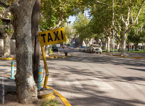 Old taxi rank in town on a sunny day.